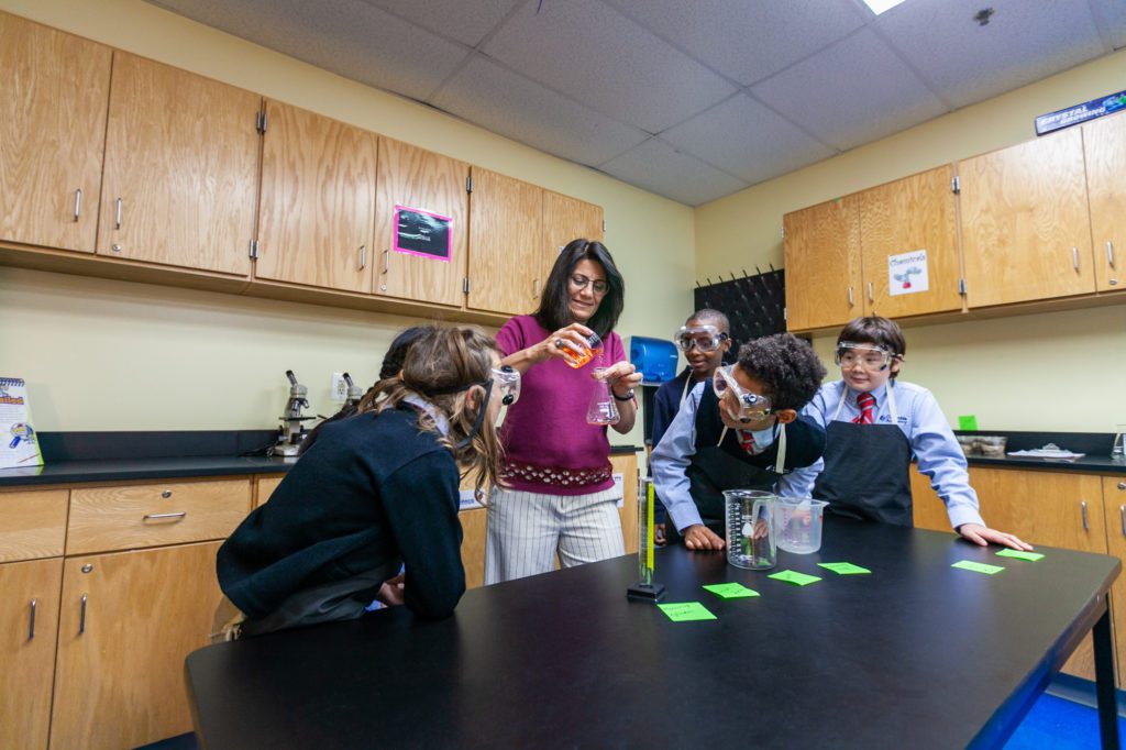 Students from a private middle school in Columbia, MD, experiment in science class as part of the school’s college-prep curriculum.